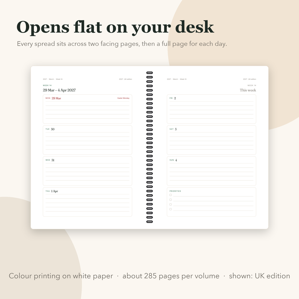 Open coil-bound planner showing a week spread across two pages