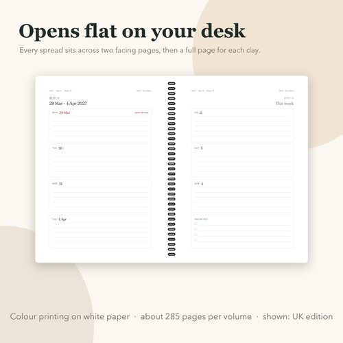 Open coil-bound planner showing a week spread across two pages